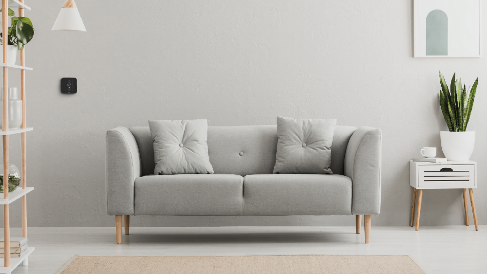 Cielo smart thermostat installed on a living room wall