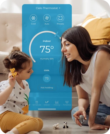 Mother daughter playing. Cielo Home app for Cielo Smart Thermostats shown in the background.