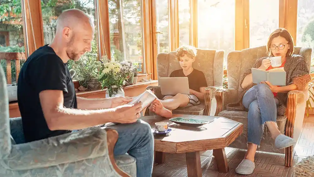 people reading in sunroom