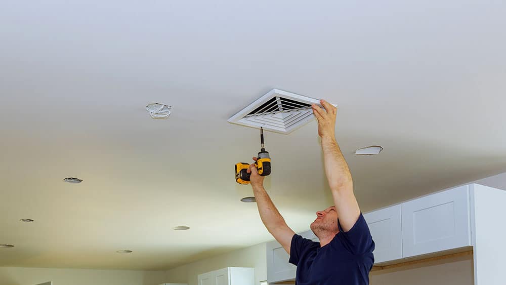 Technician fixing the vent.