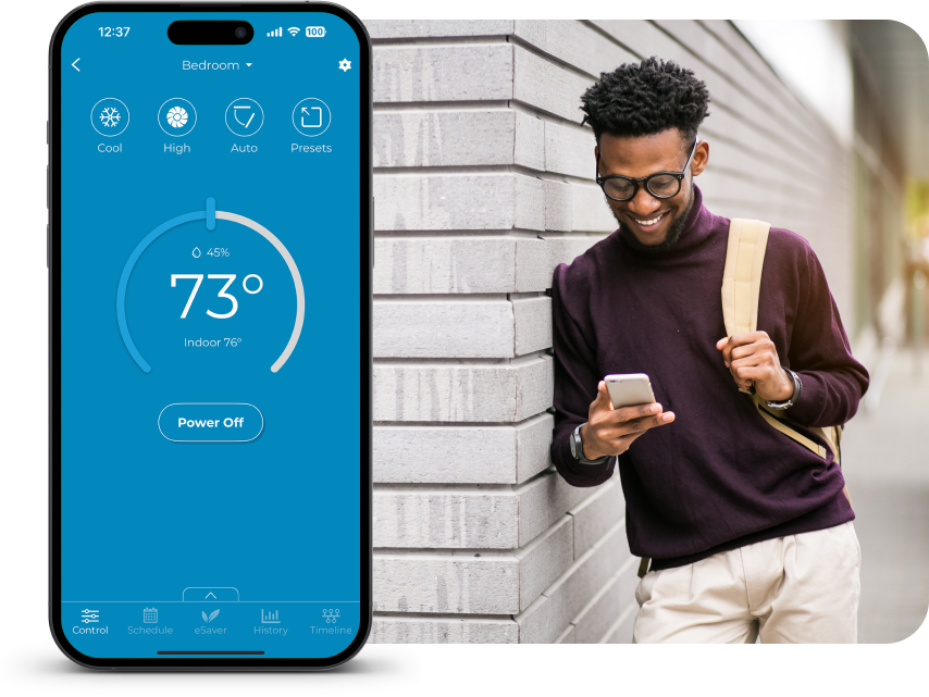 A man using Cielo Home app to manage his home climate.