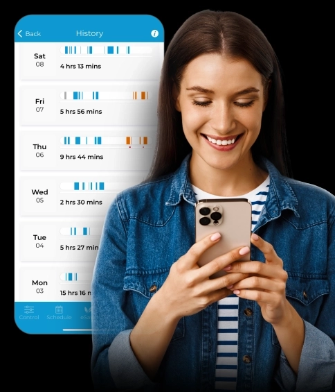 A woman monitoring her AC usage history using Cielo Home app for efficient management
