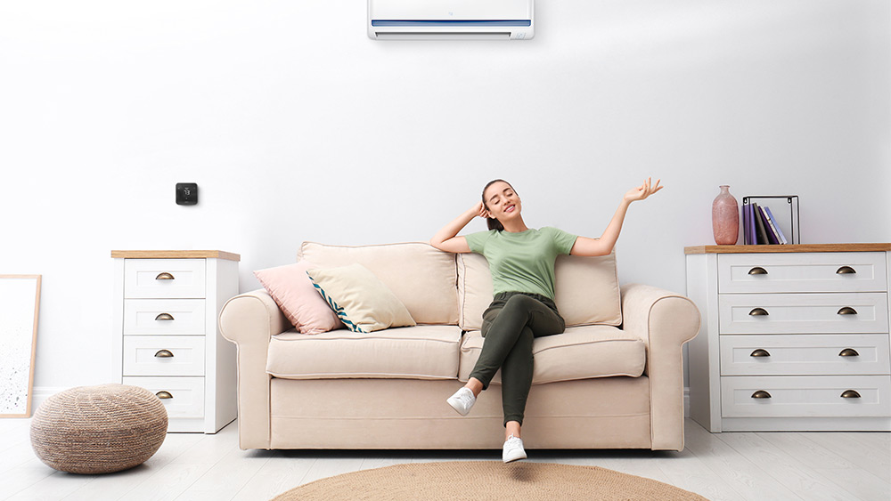 woman enjoy cool air from minisplit ac