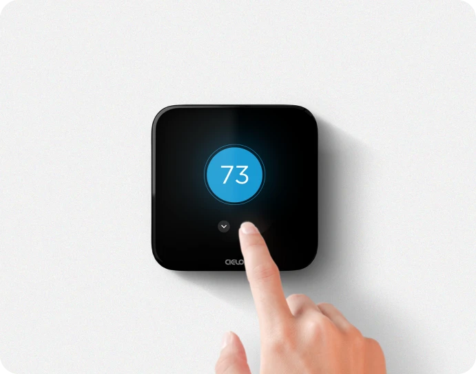 A person adjusting temperature on breez edge