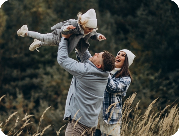 Happy family enjoying winter outdoors.