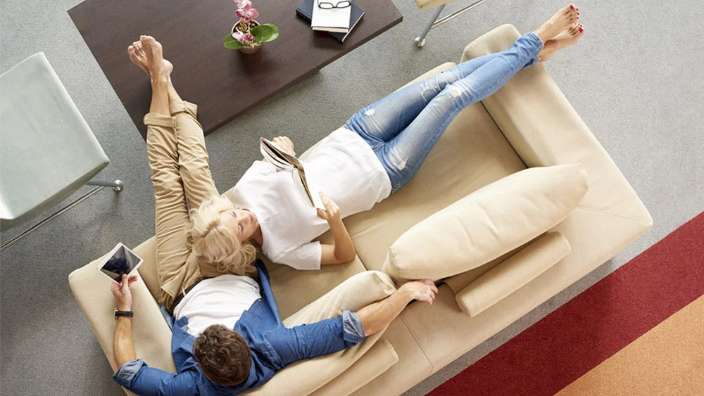 family sitting on the sofa enjoying in the comfort