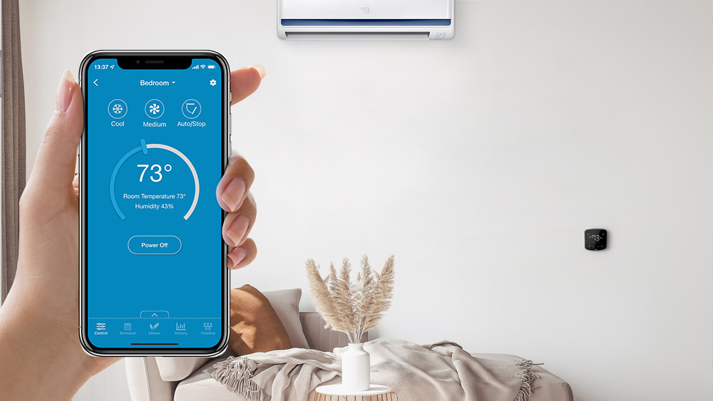 A person using cielo home app to control mini-split temperature settings