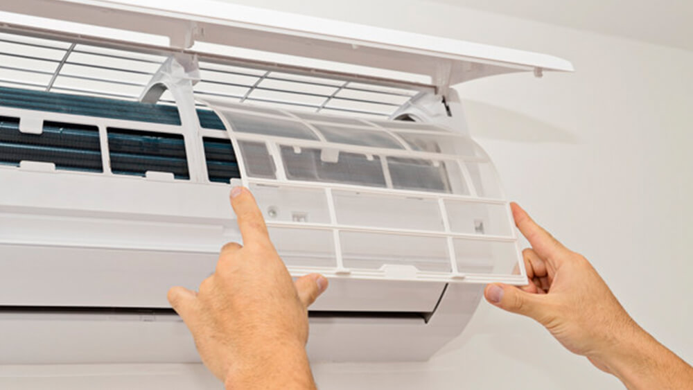 AC filter is being changed for an air conditioner tune up.