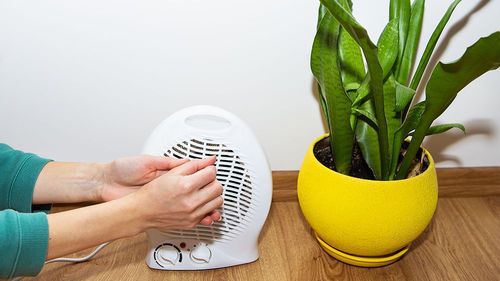 A woman using space heater