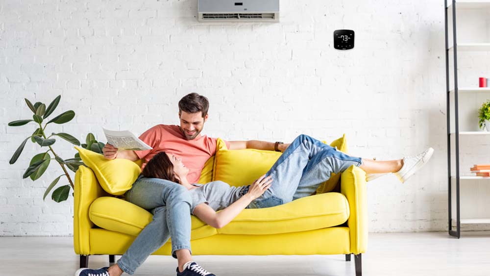 Cielo Breez Plus installed in an energy efficient home. yellow sofa.